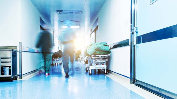 A blurred image of a hospital corridor