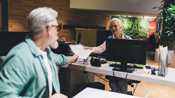 Two older workers in an office