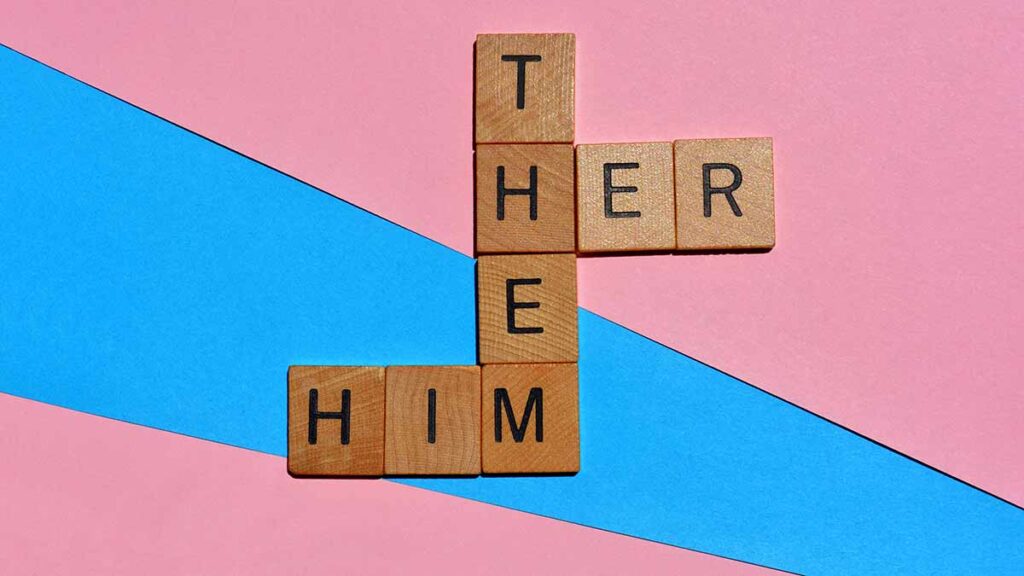 Picture shows Scrabble letters with the words HER, HIM and THEM to illustrate a story about gender critical preferred pronouns employment tribunal case.