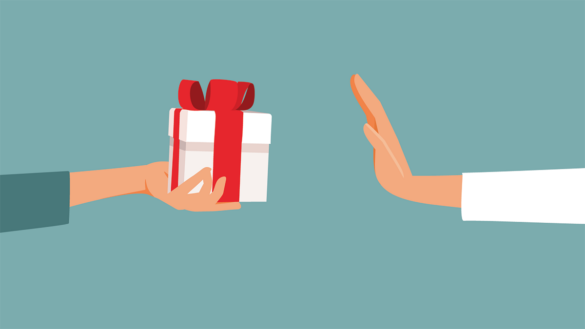 When is accepting gifts bribery? Image shows a hand refusing a gift.