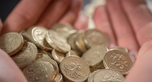 National living wage 2025, national minimum wage 2025: Image shows a pile of pound coins.