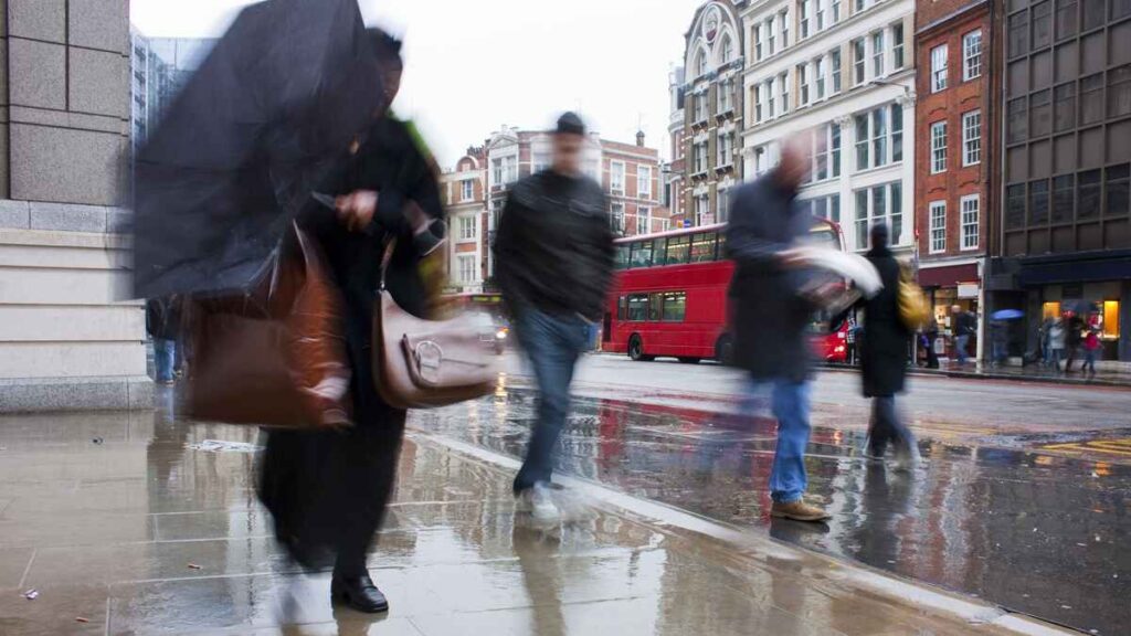 Commuters in rain in winter